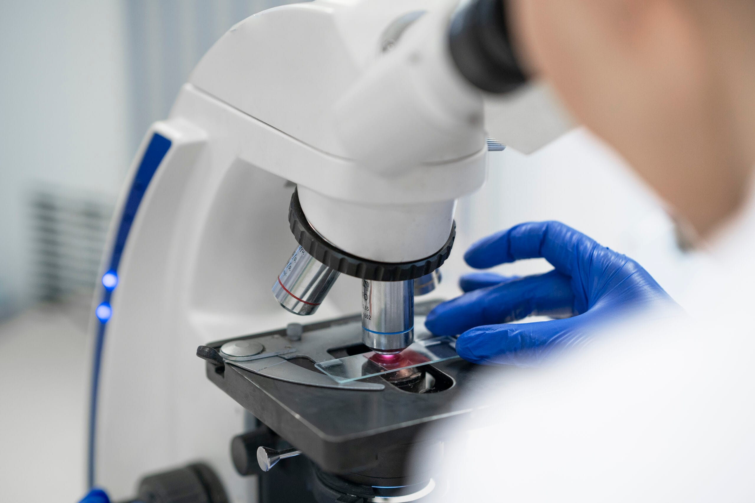 doctor performing medical research lab scaled